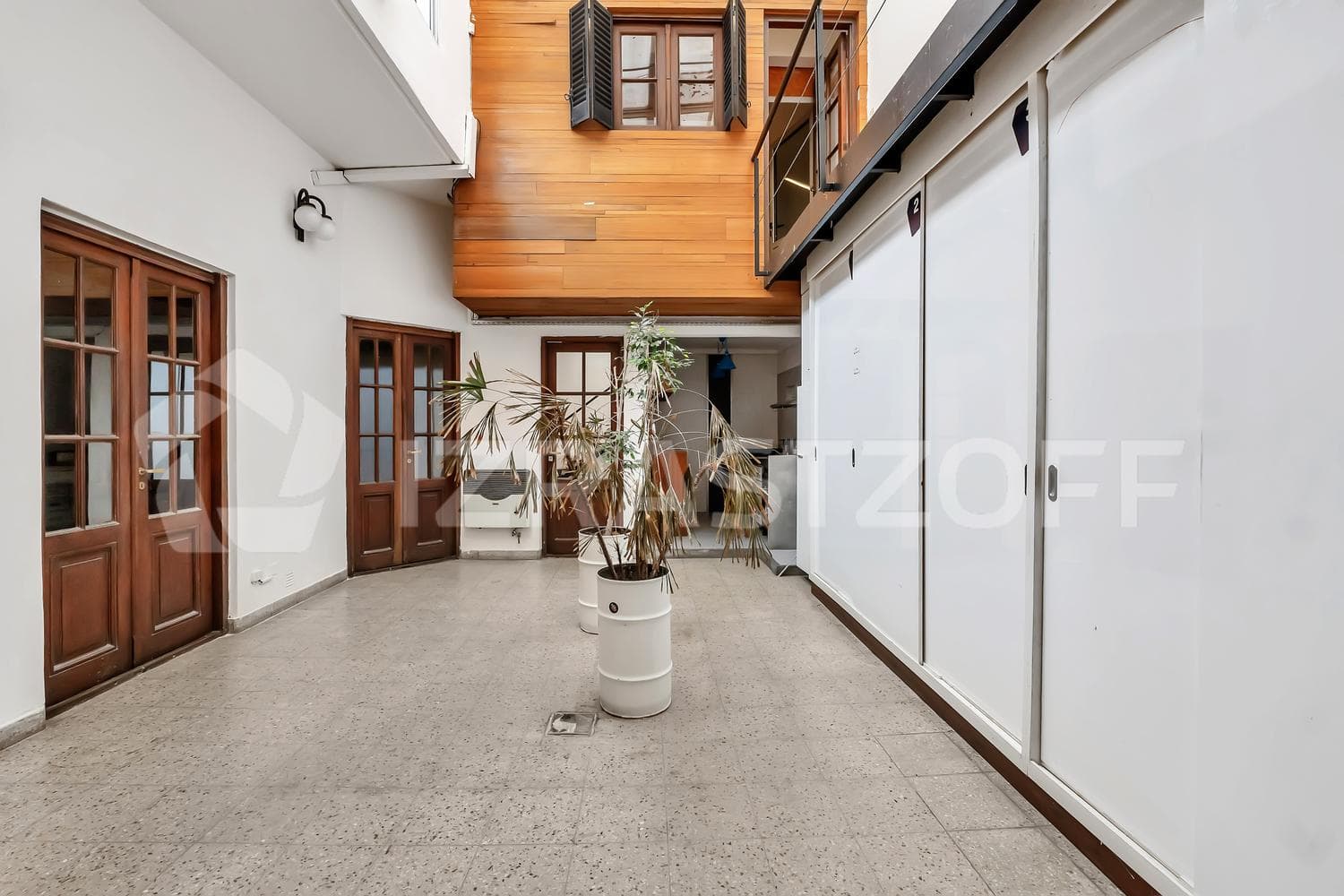 For Sale: Renovated Townhouse with Private Patio on Two Floors, Featuring a Grill