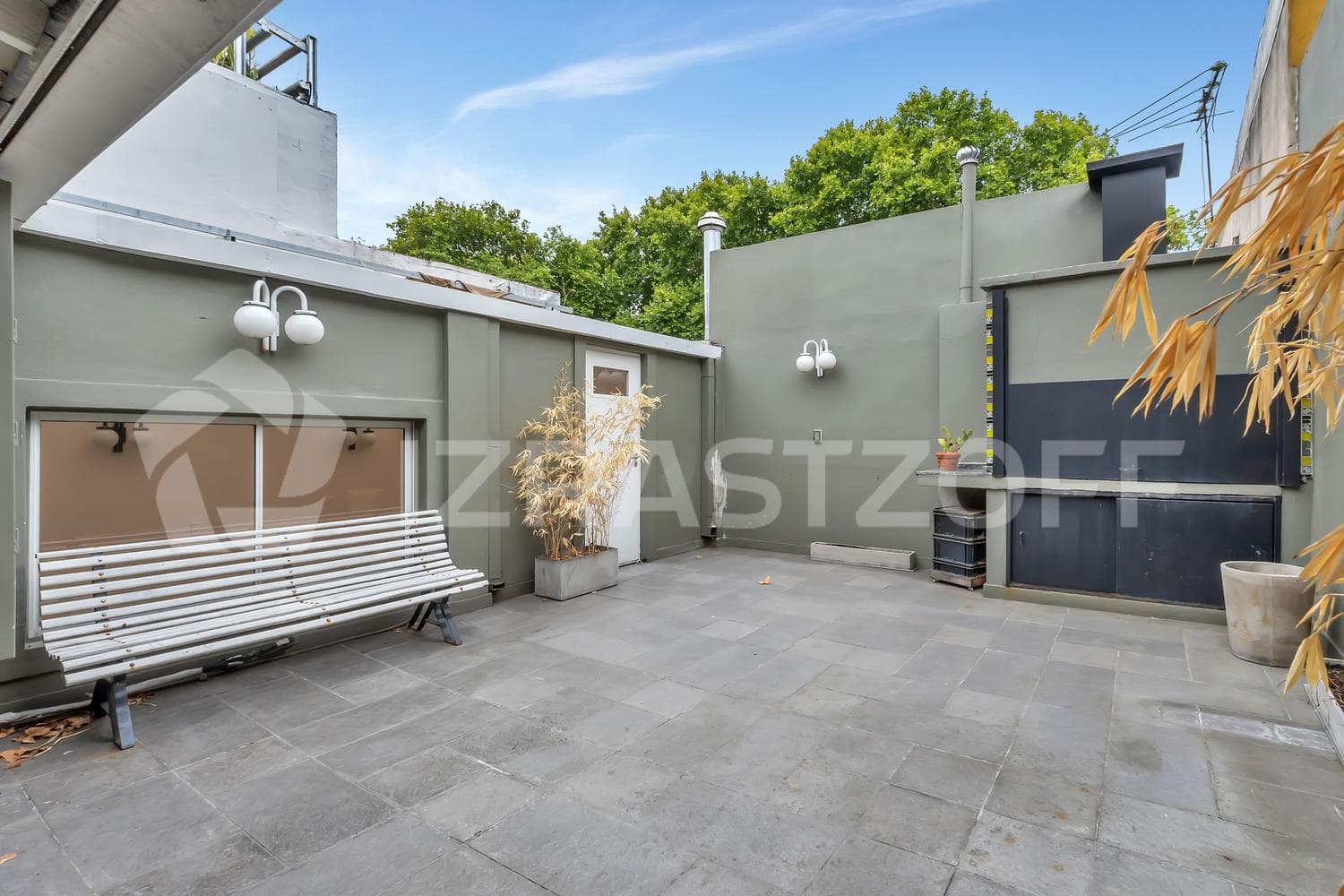 For Sale: Renovated Townhouse with Private Patio on Two Floors, Featuring a Grill