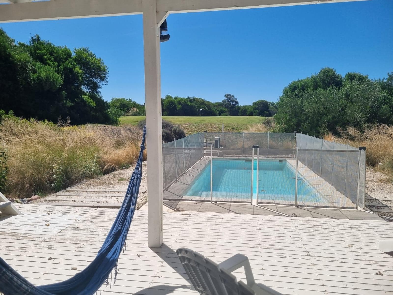 A beautiful house in Costa Esmeralda Golf 2, with a pool, a barbecue, and a view of the golf course.