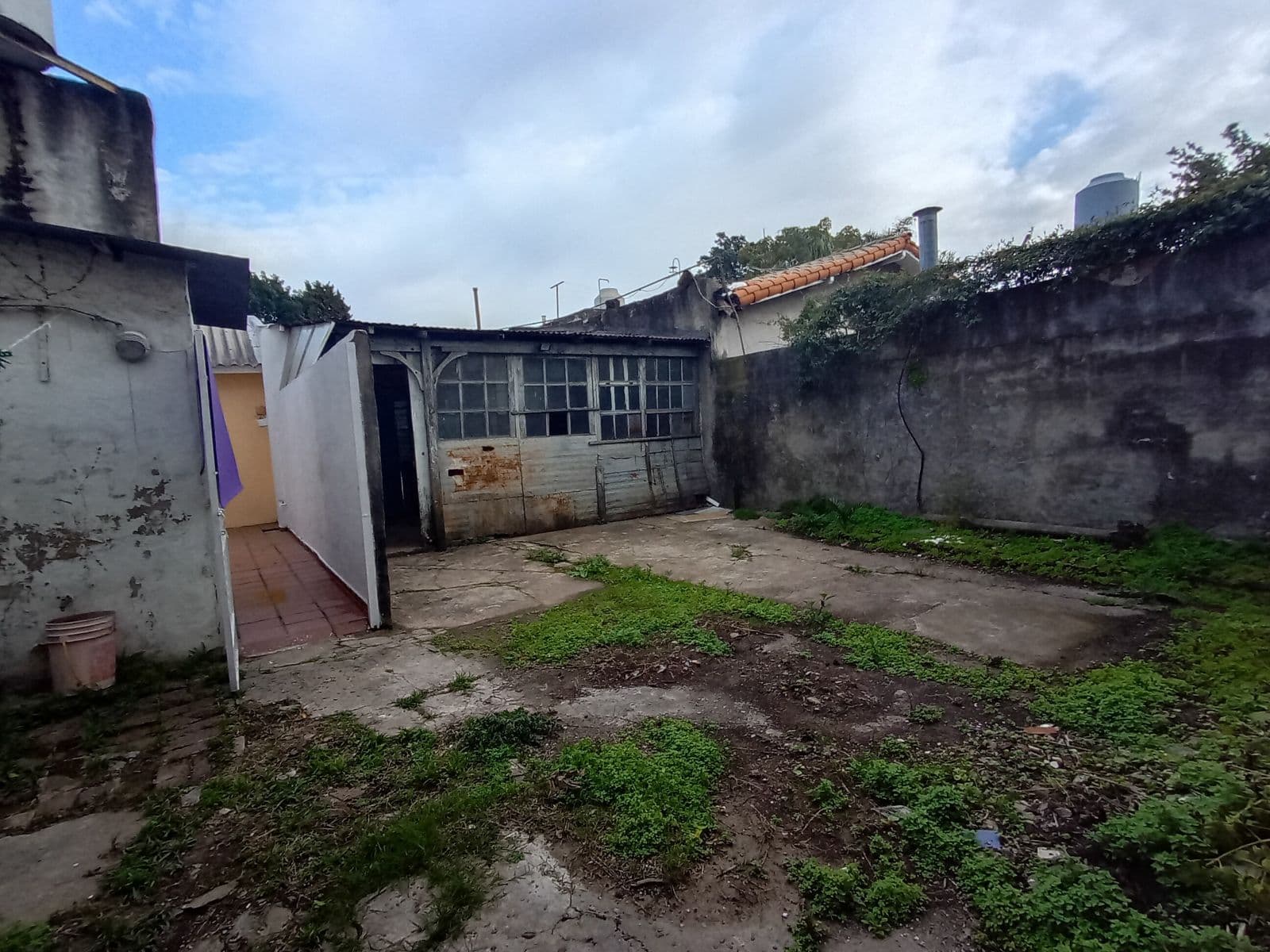 3-Bedroom Home with Garages and Backyard