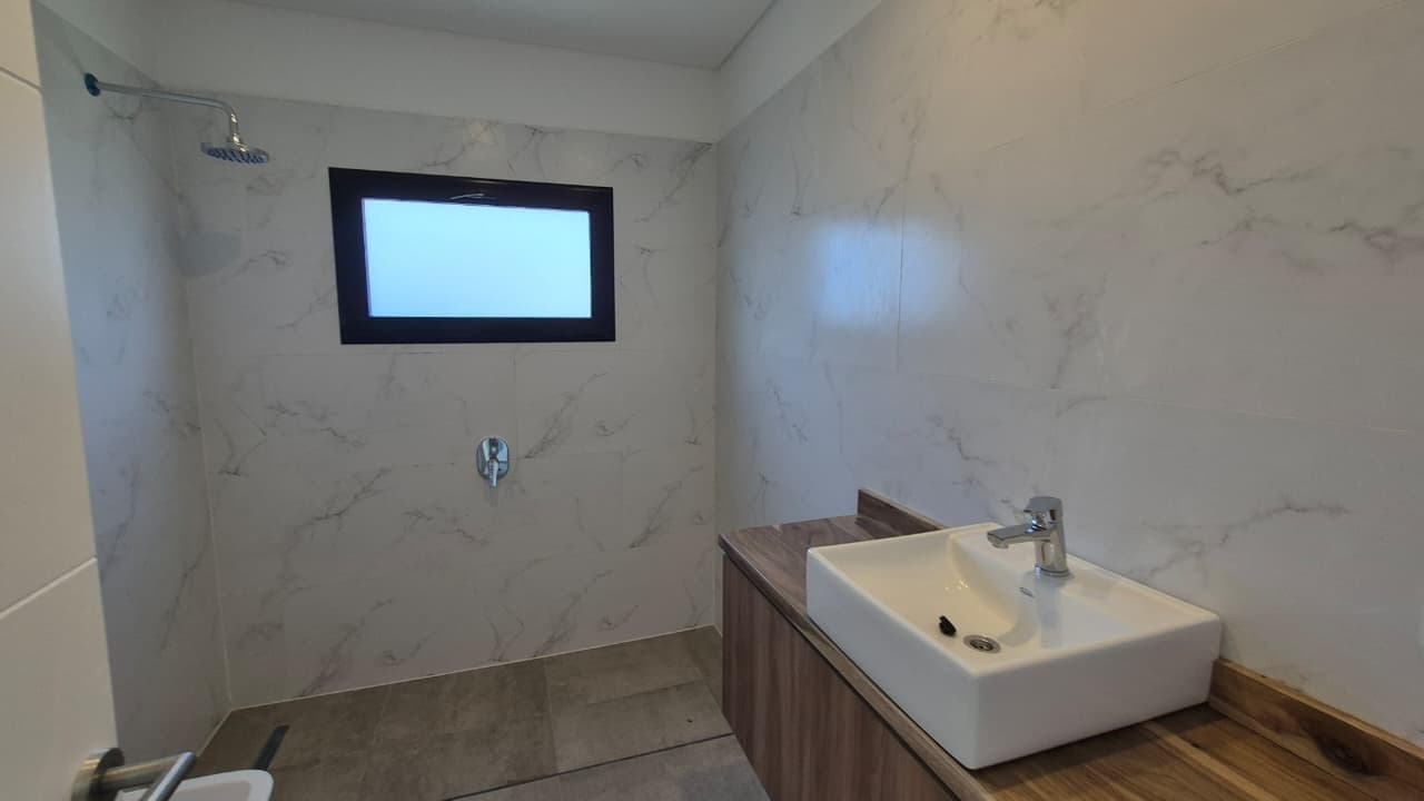 FOR SALE: Brand-new single-story house in Canton Norte overlooking a body of water