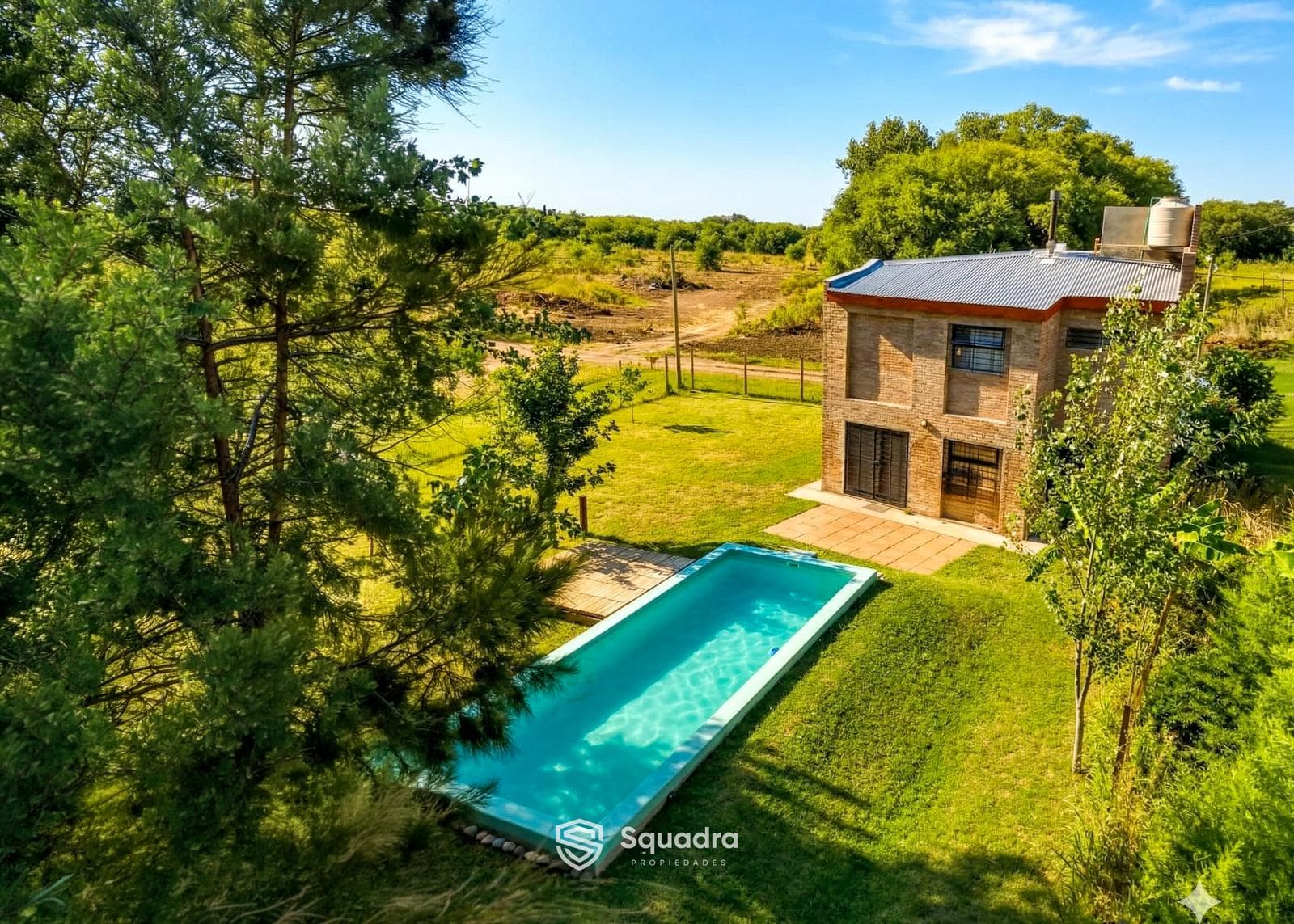 FOR SALE - 2-bedroom house with pool, yard, and garage - Bosque Azul, Funes. MORTGAGE ELIGIBLE.