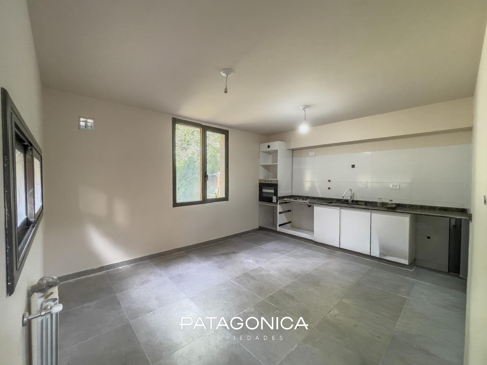 2-Room Apartment with Private Garden and Garage