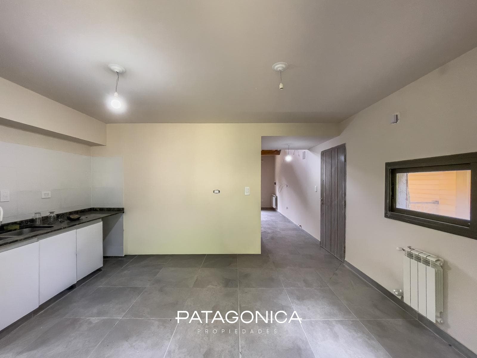 2-Room Apartment with Private Garden and Garage