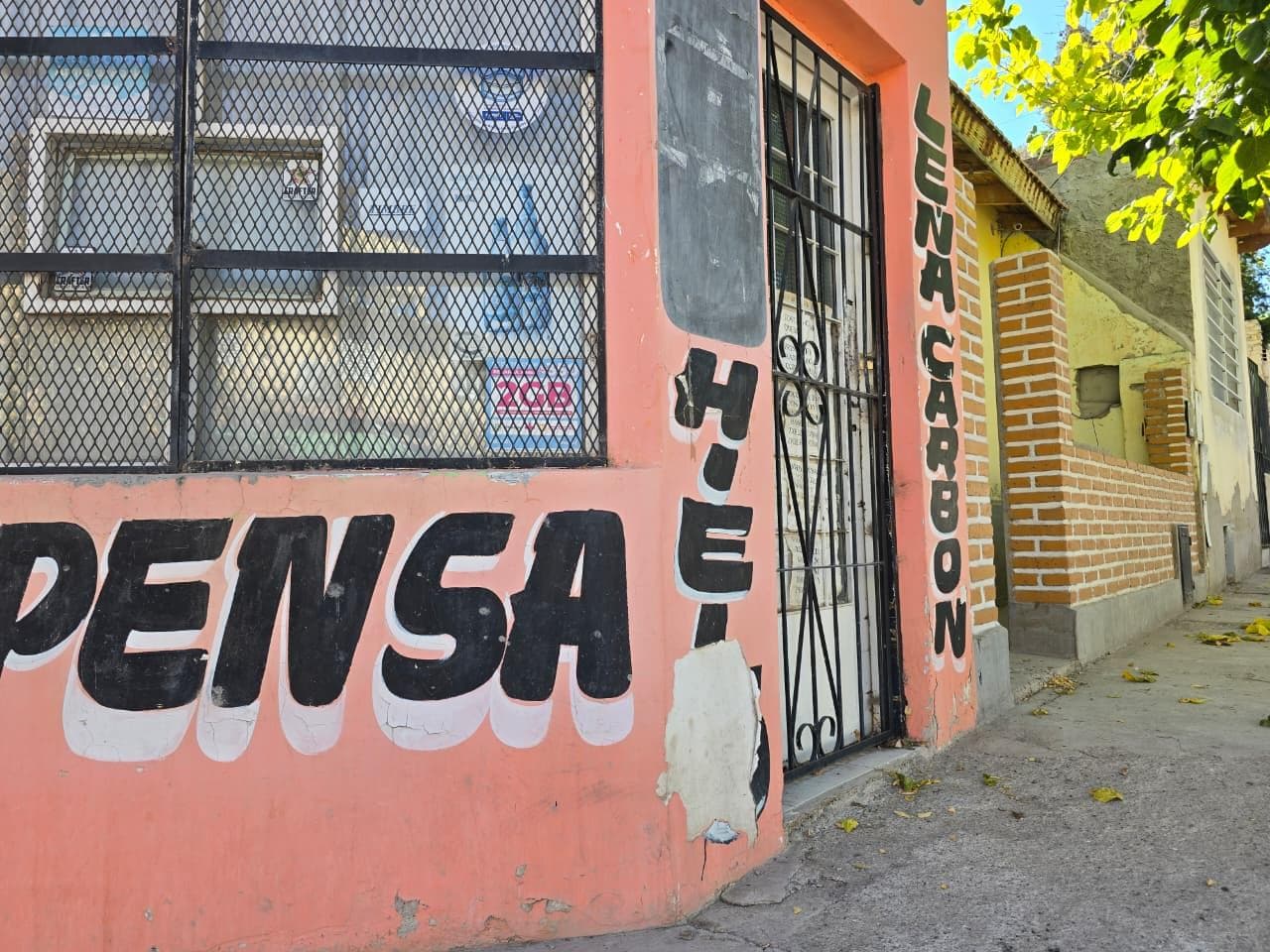 Sale: Duplex with commercial storefront on a corner.