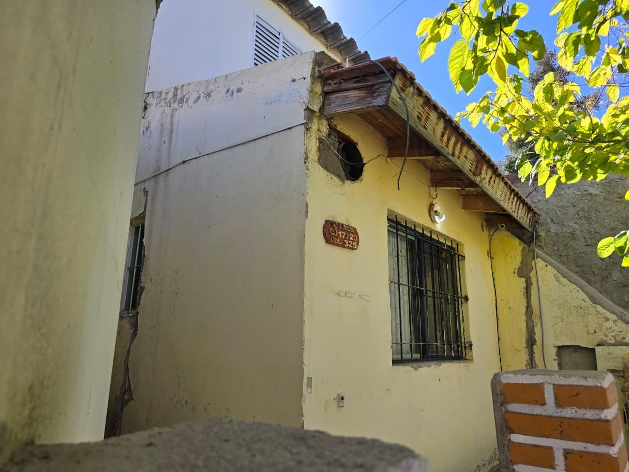 Sale: Duplex with commercial storefront on a corner.