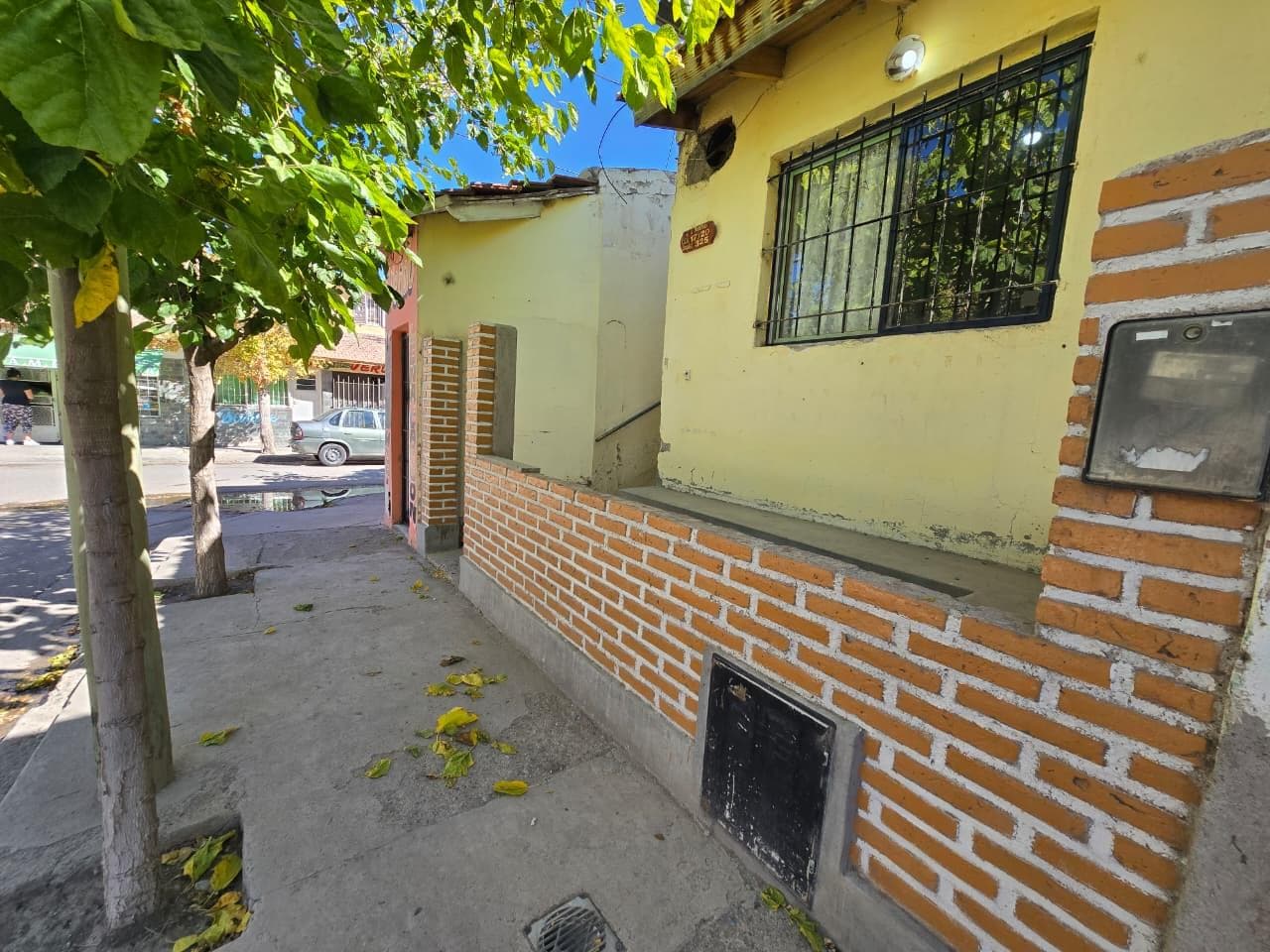 Sale: Duplex with commercial storefront on a corner.
