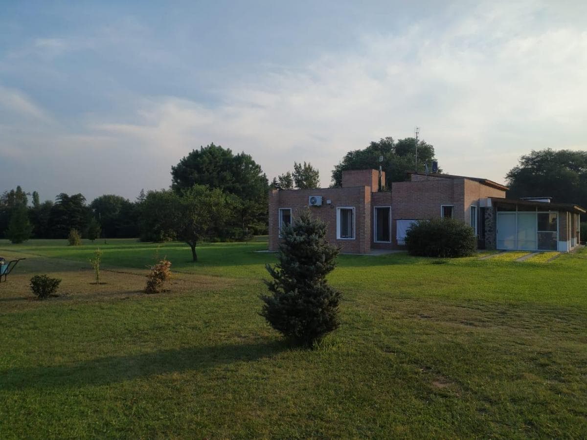 House in Anisacate | 4.5 Ha of Natural Beauty: Fruit Grove, Private Stream, and Large Pool