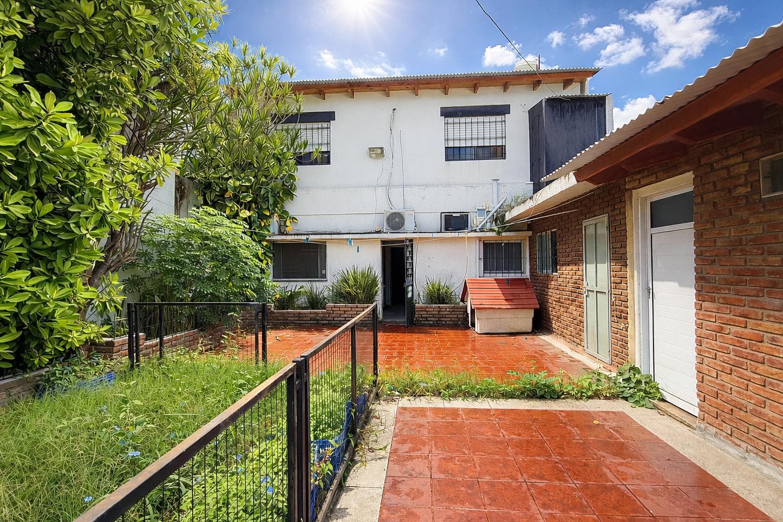 House on the street with a garden and a garage