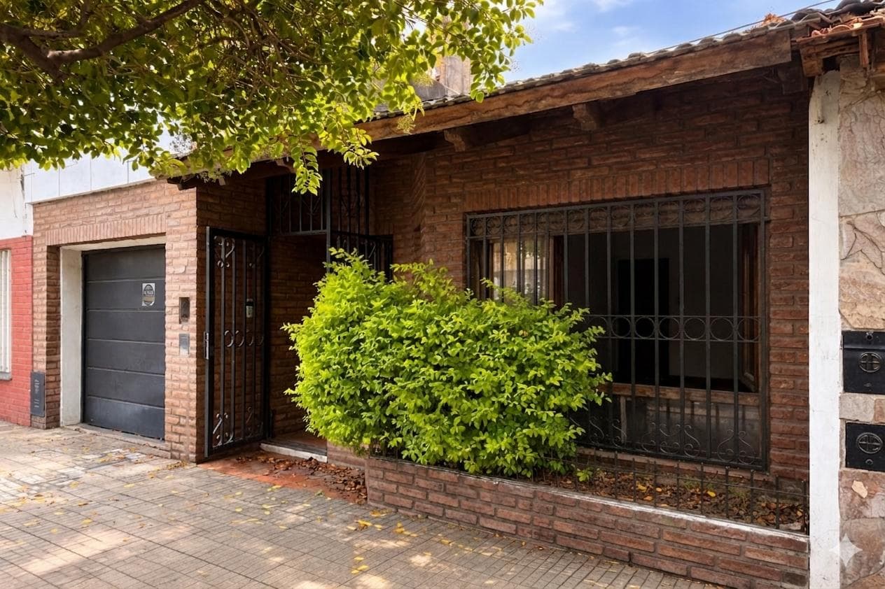 House on the street with a garden and a garage
