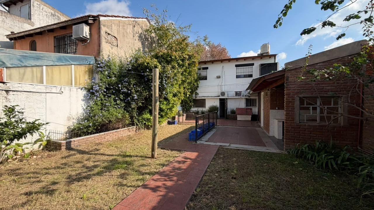 House on the street with a garden and a garage