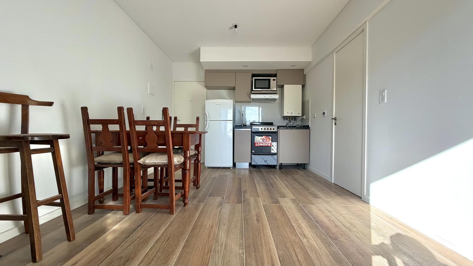 1-bedroom apartment with a grill on the balcony