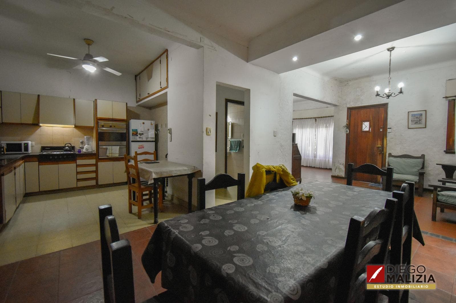 5-room house with a patio, grill, outdoor dining area, and garage for sale in Banfield
