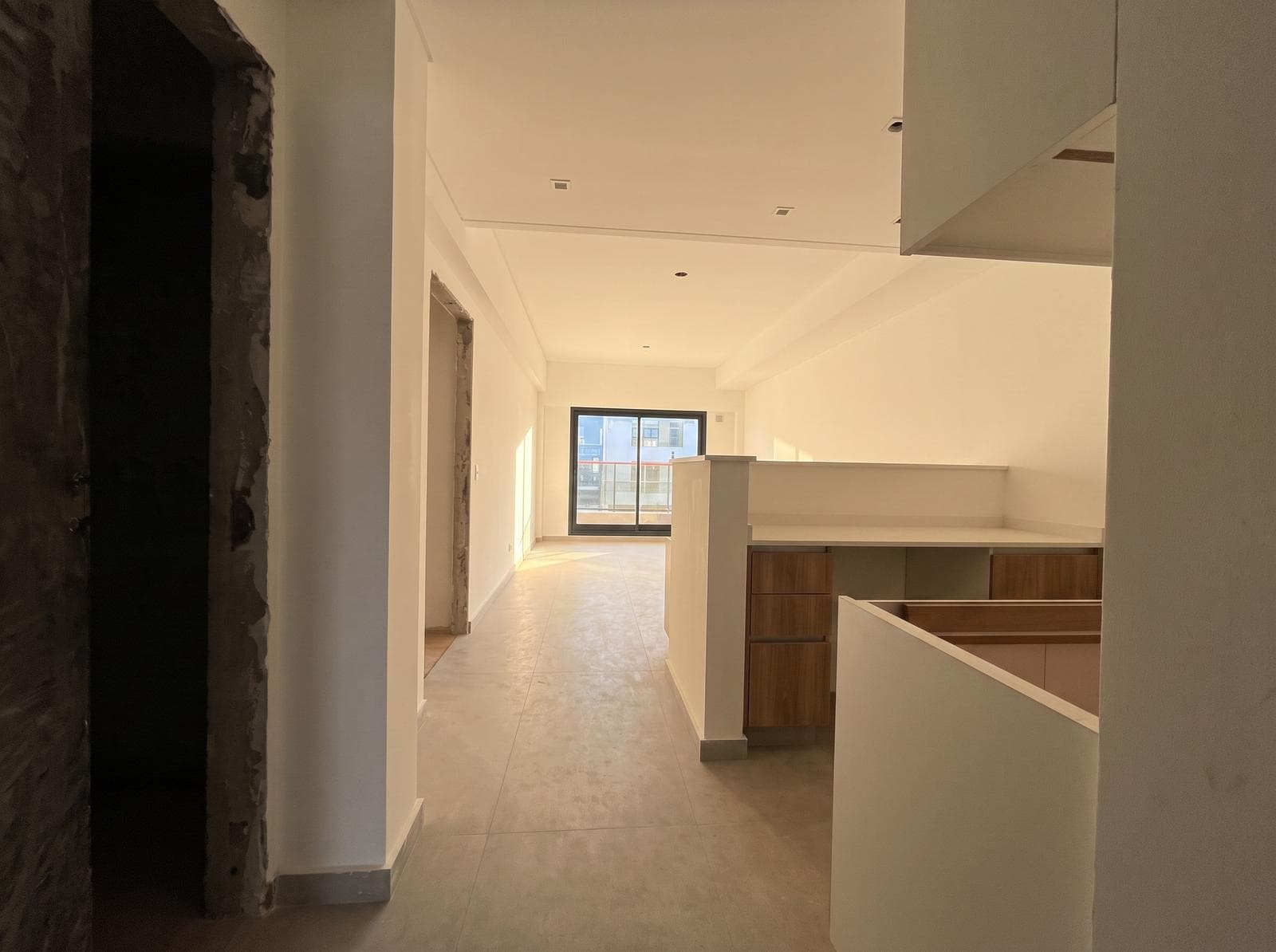 Two-room apartment with an en suite bedroom, a full-length balcony, and a half-bath
