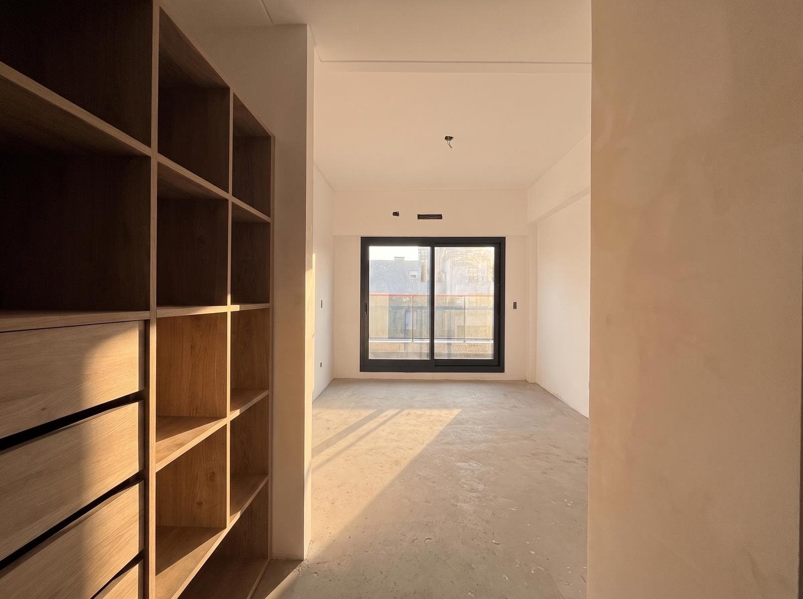 Two-room apartment with an en suite bedroom, a full-length balcony, and a half-bath