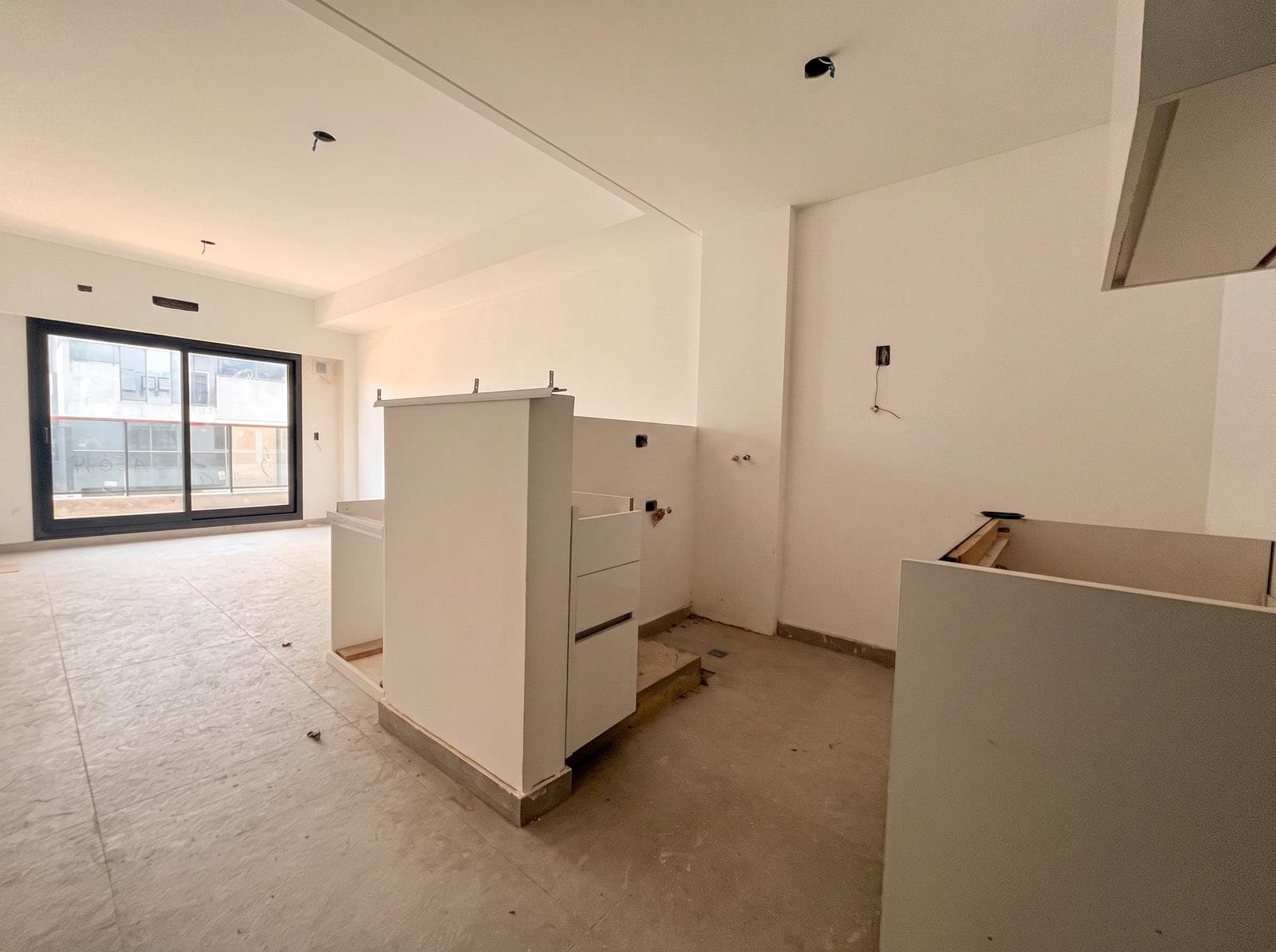 Two-room apartment with an en suite bedroom, a full-length balcony, and a half-bath
