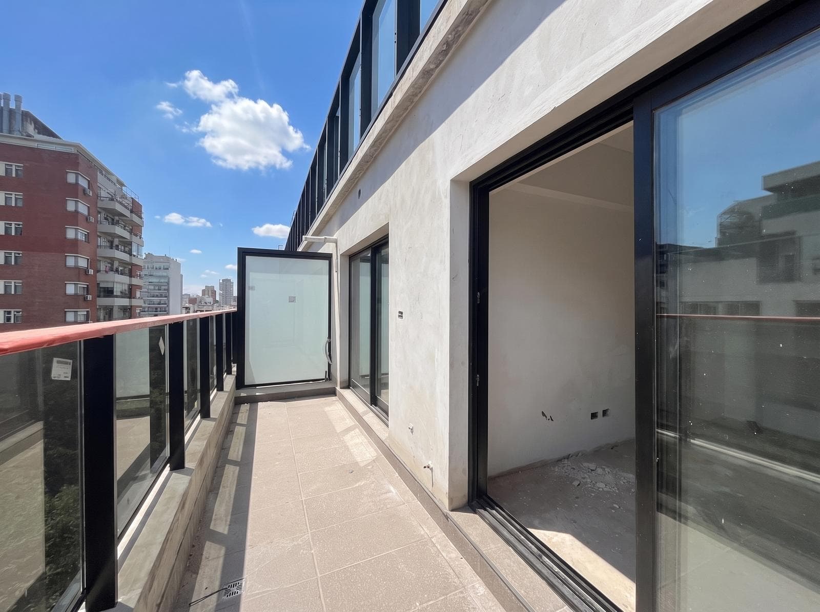 Two-room apartment with an en suite bedroom, a full-length balcony, and a half-bath