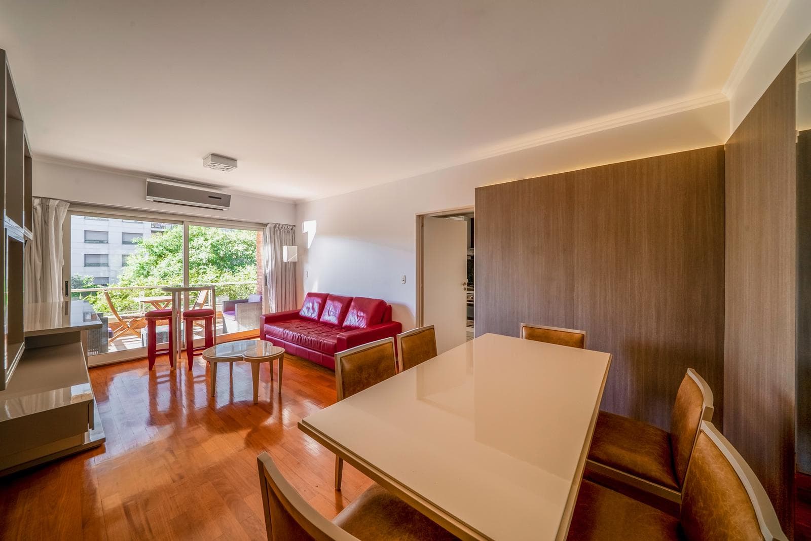 Two-room furnished apartment with a balcony and garage available for short-term rent in Puerto Madero