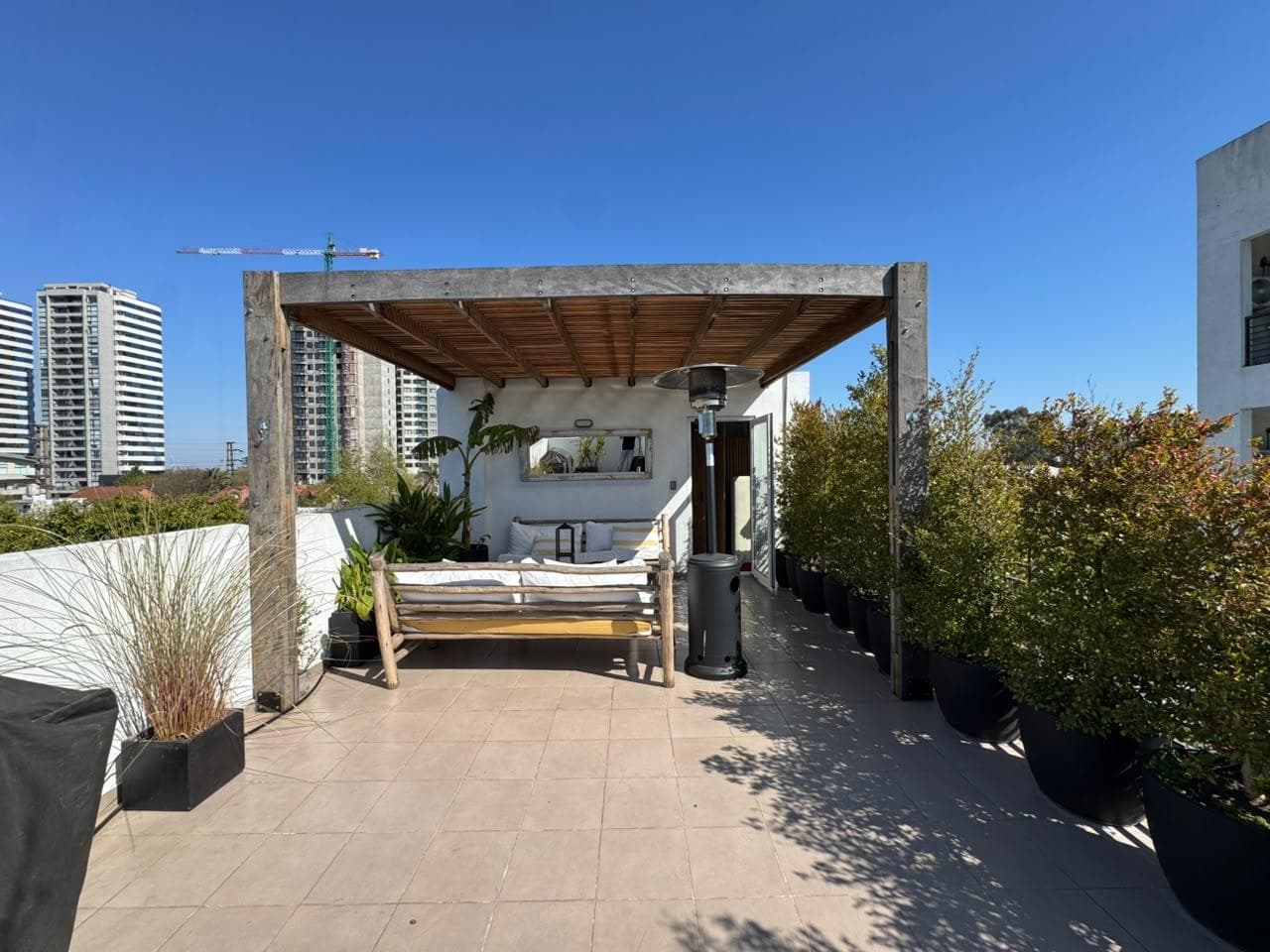 For Sale: Exclusive Triplex with Large Private Terrace, Two Bathrooms, a Half-Bath, and a Garage
