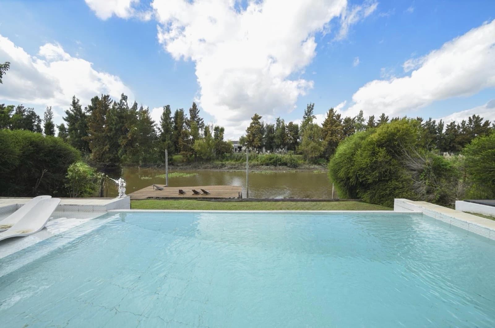 House by the River with a Pool in the San Benito Nautical Neighborhood
