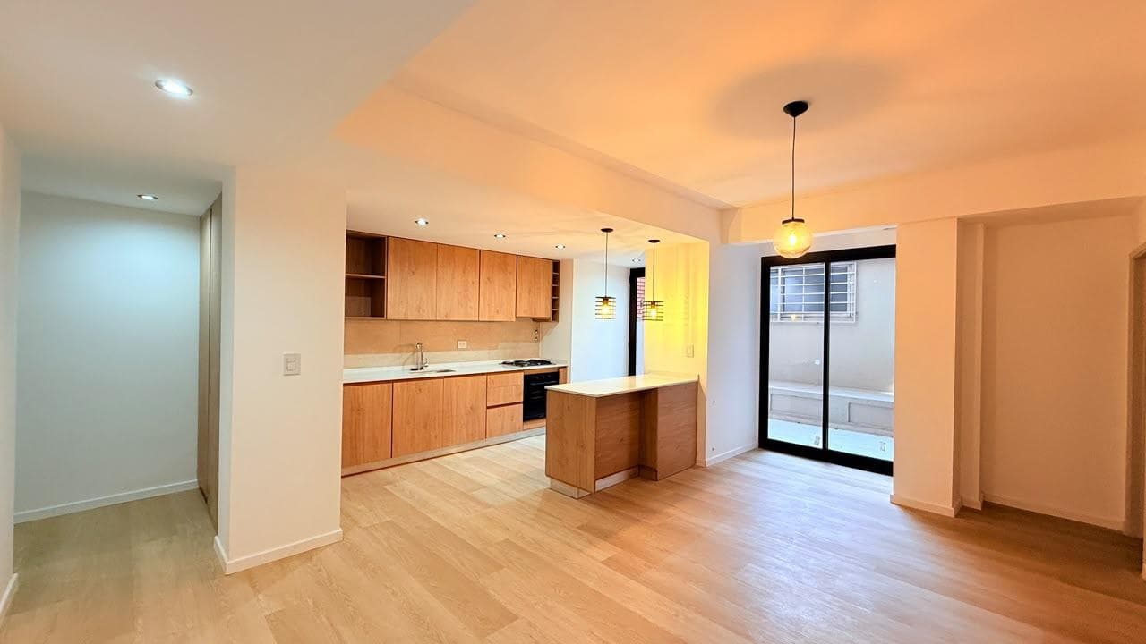 Exclusive 2-Bedroom Apartment with En-Suite Bathroom and Private Patio on Oroño Street, Featuring Recycled Designer Gold