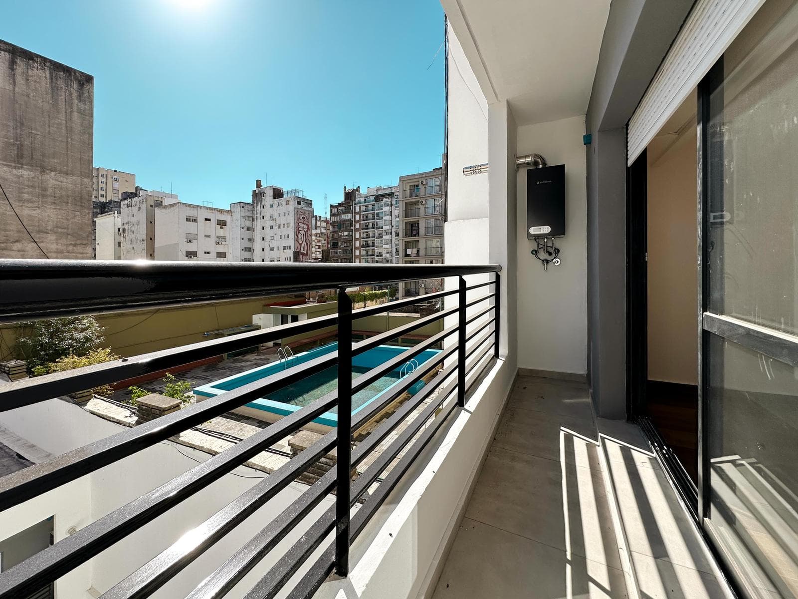 Brand-new studio apartment with a balcony facing the rear of the building