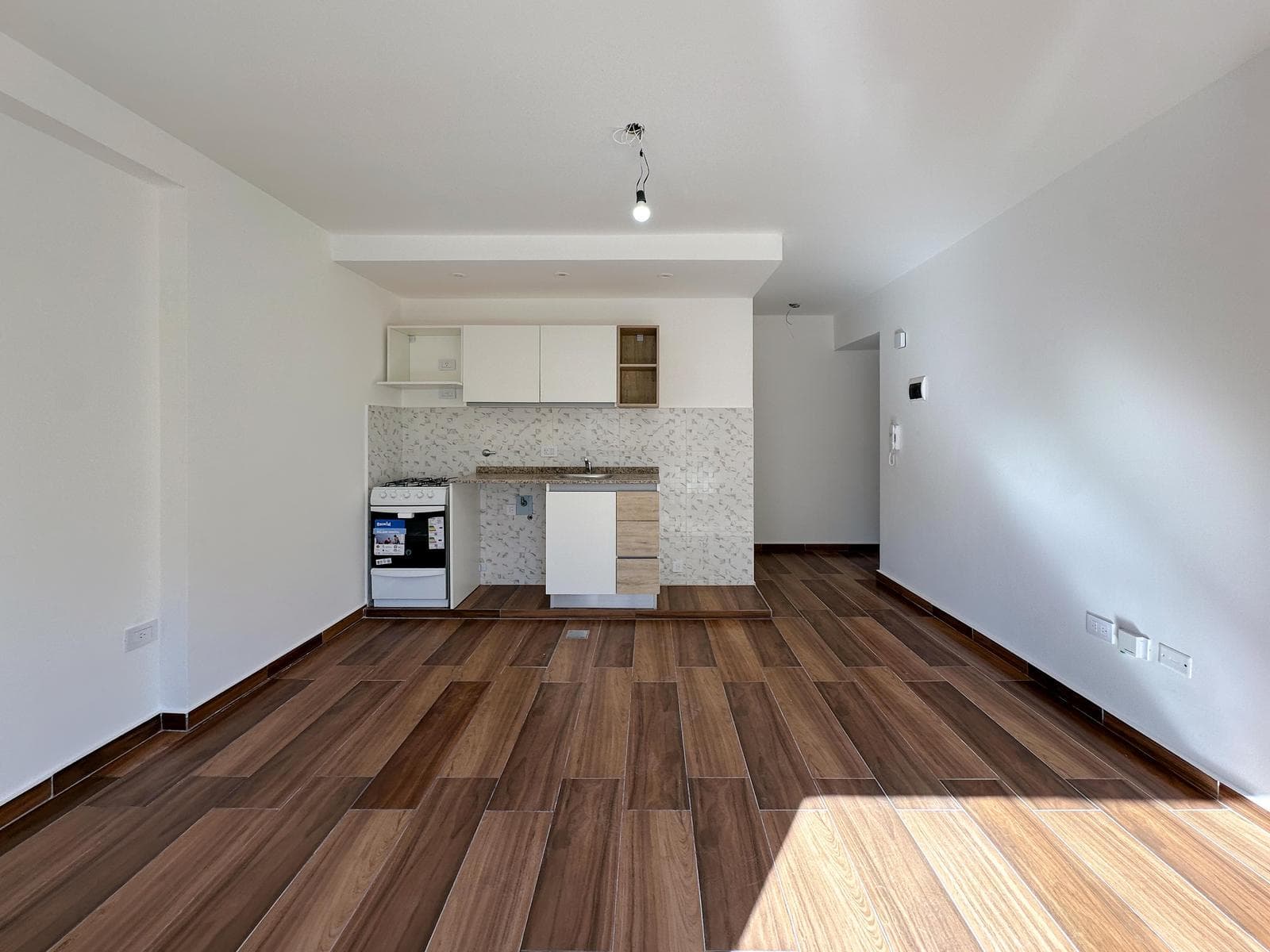 Brand-new studio apartment with a balcony facing the rear of the building