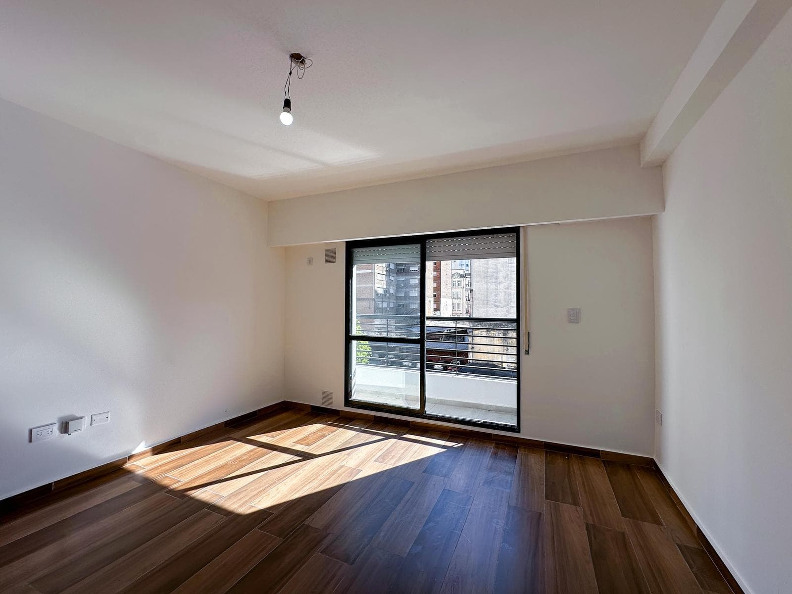 Brand-new studio apartment with a balcony facing the rear of the building