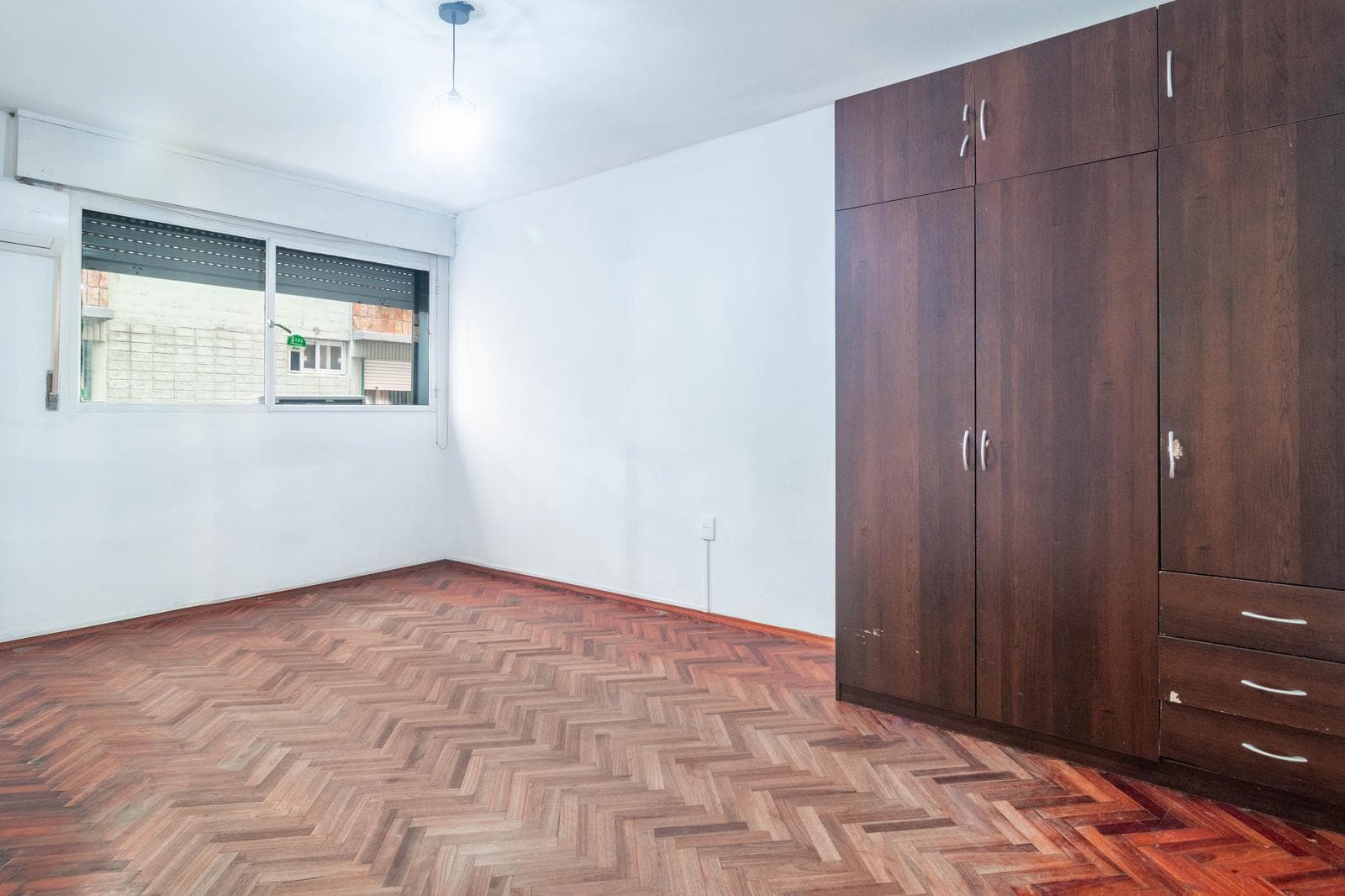For sale: 3 spacious bedrooms, street-facing, with a separate kitchen.