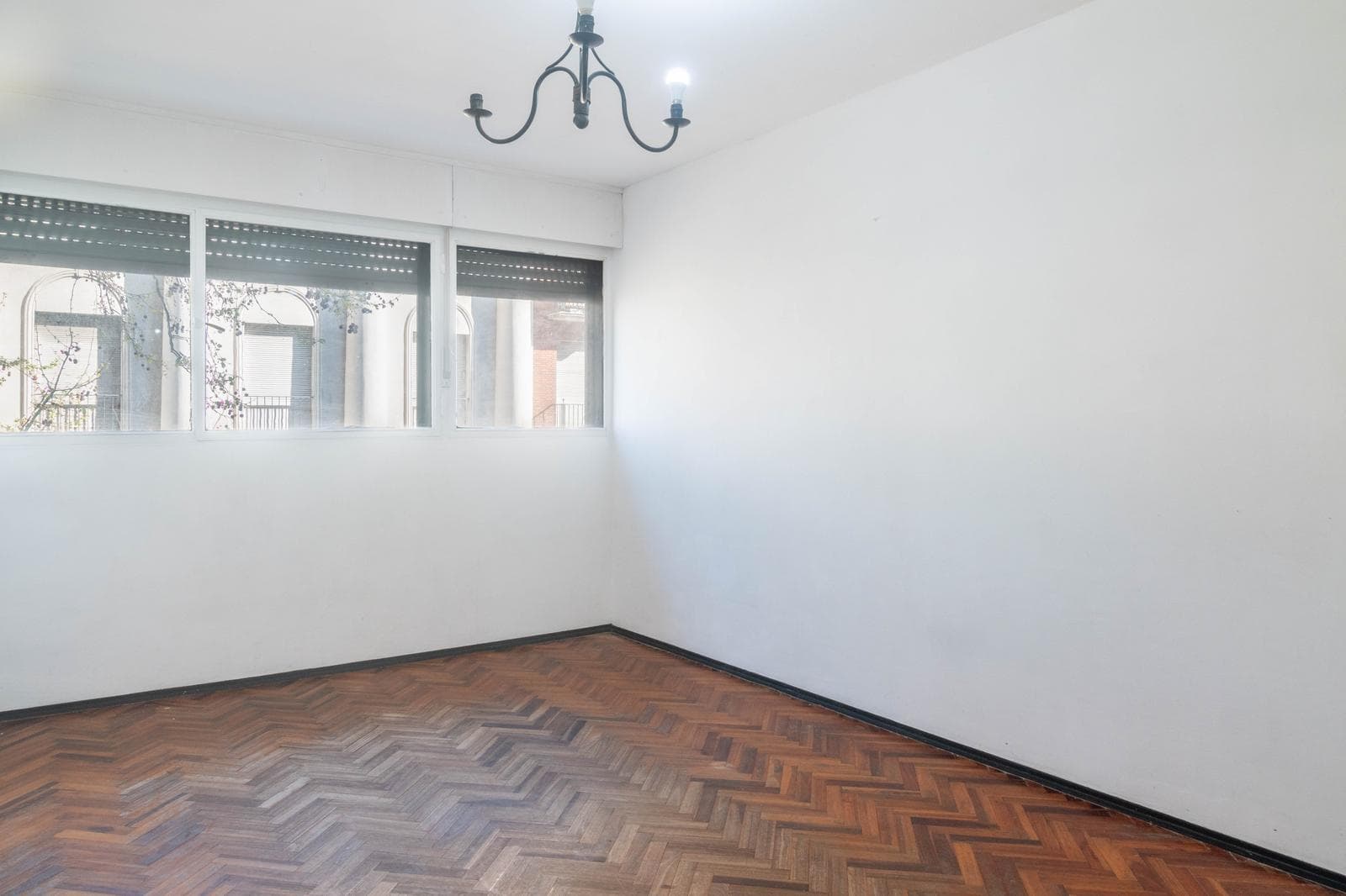 For sale: 3 spacious bedrooms, street-facing, with a separate kitchen.