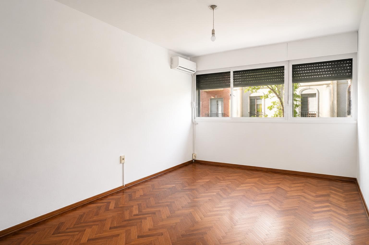 For sale: 3 spacious bedrooms, street-facing, with a separate kitchen.