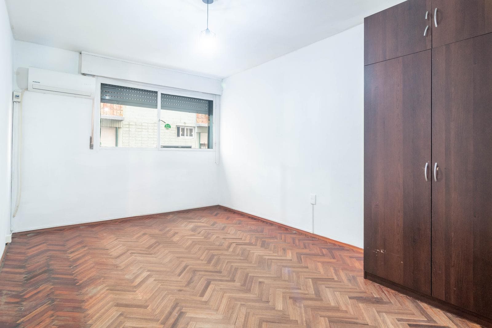 For sale: 3 spacious bedrooms, street-facing, with a separate kitchen.