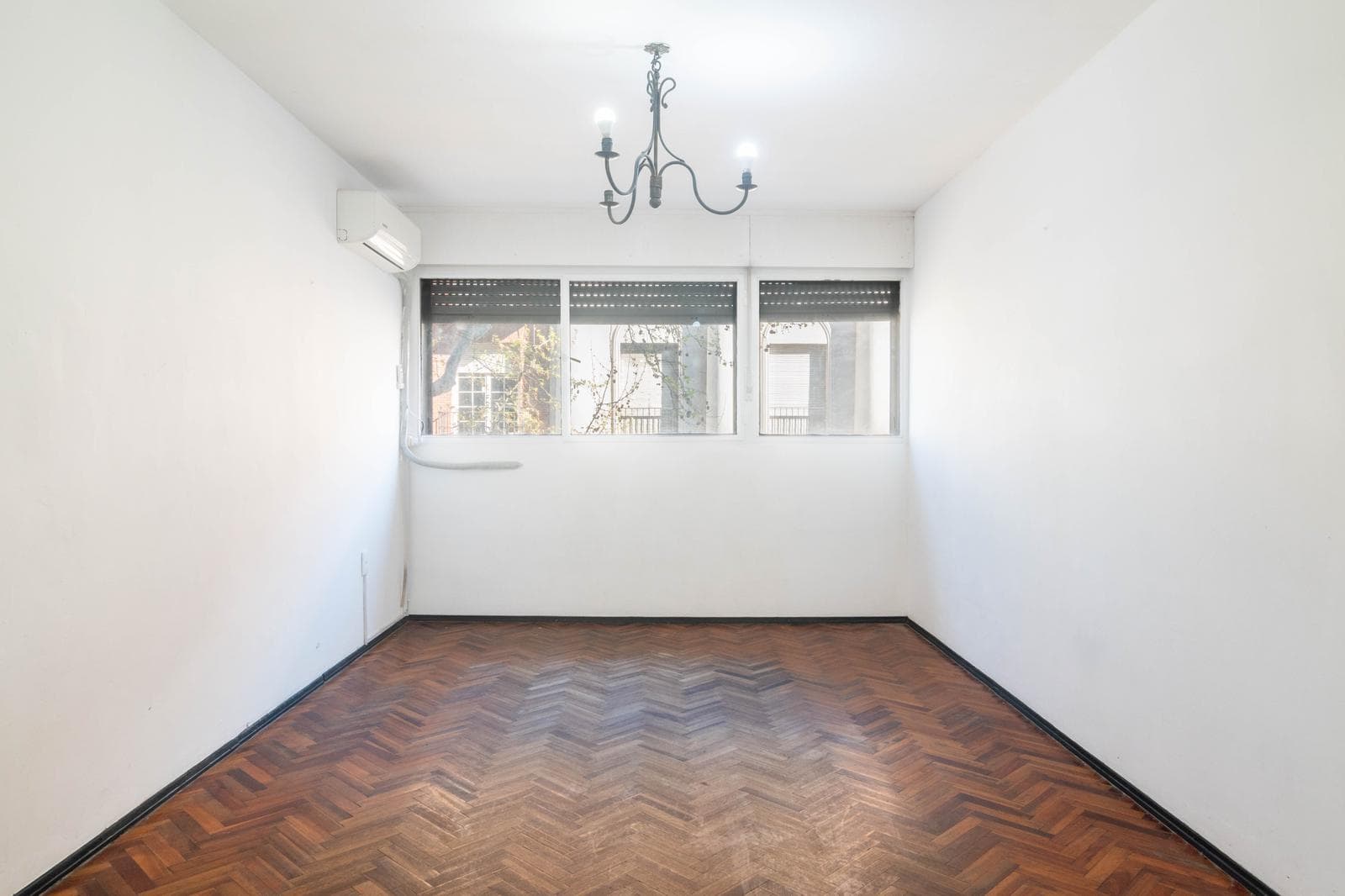 For sale: 3 spacious bedrooms, street-facing, with a separate kitchen.