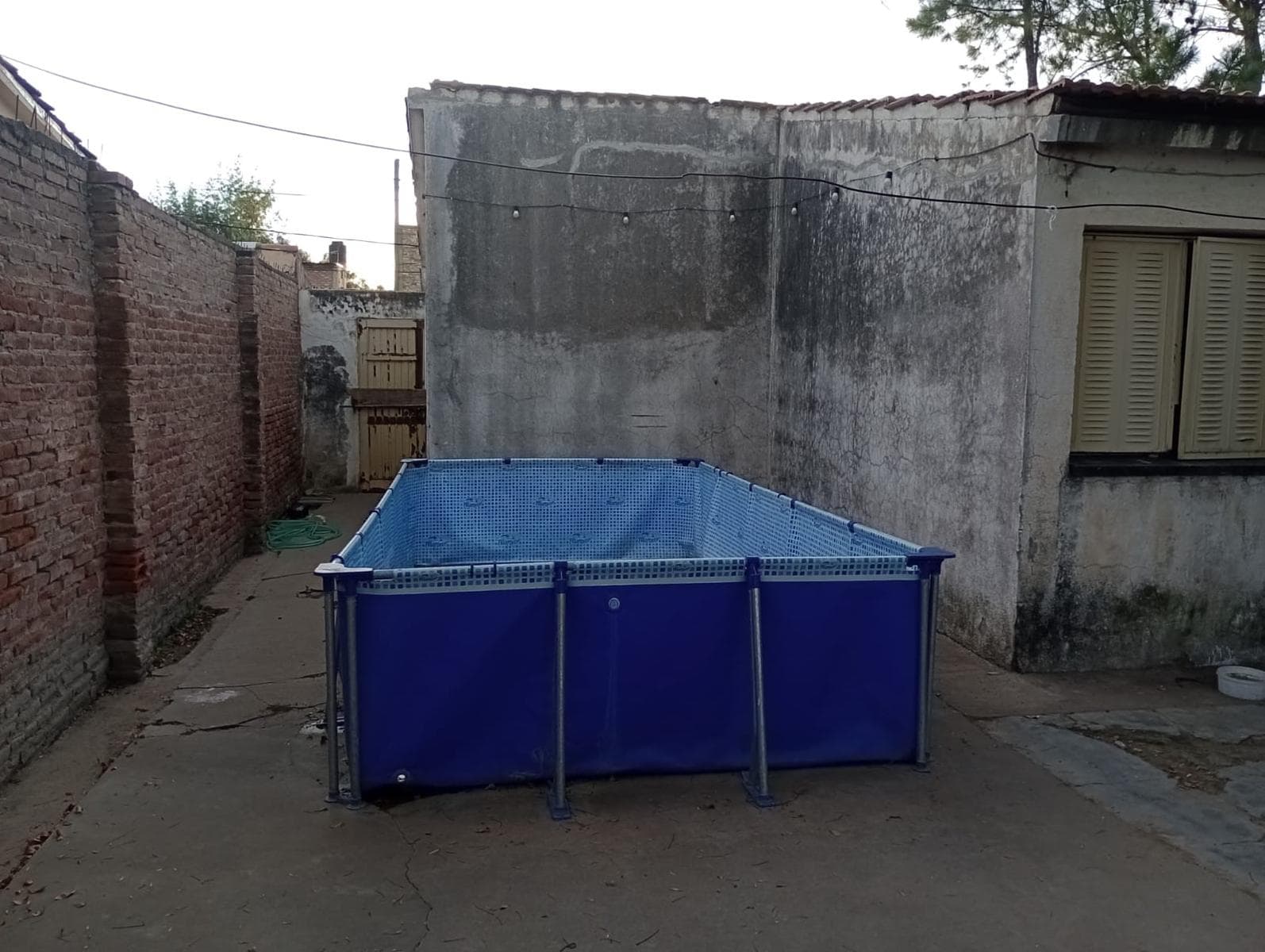 House with 3 bedrooms, a semi-covered garage, and a patio.