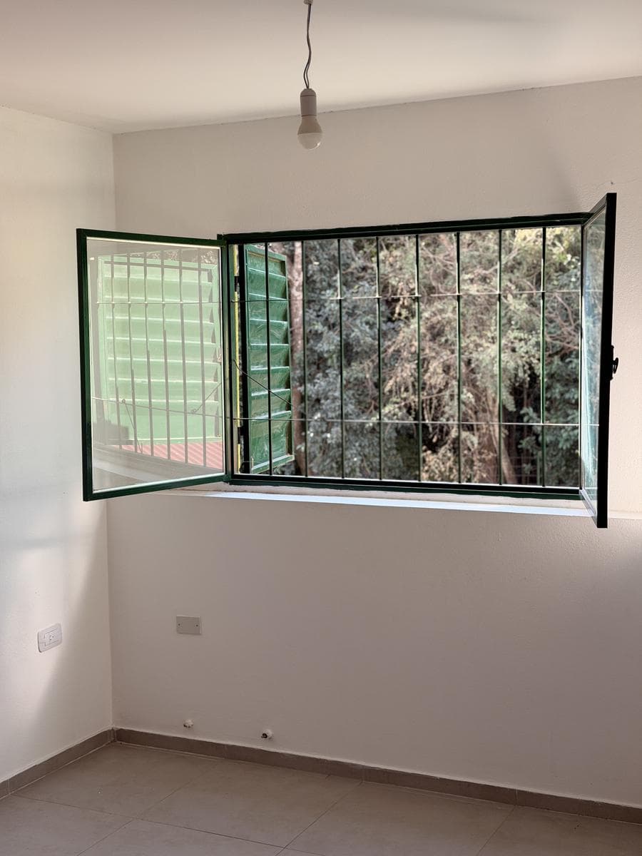 Apartment with a patio just a few meters from Route 5 and the Anisacate River