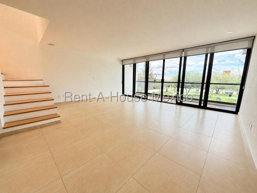 Duplex-style apartment for rent on an upper floor with a private terrace. Altos de Juriquilla