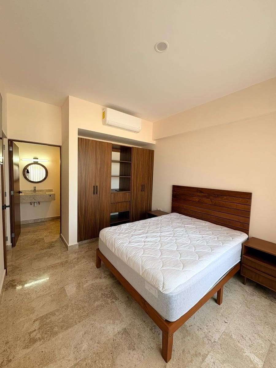 Apartment with 2 bedrooms, 2 bathrooms, living/dining room with kitchen and ocean view, laundry area, terrace, elevator, 24-hour security, covered parking for one car, rooftop garden, event hall, pool, social area, and gym