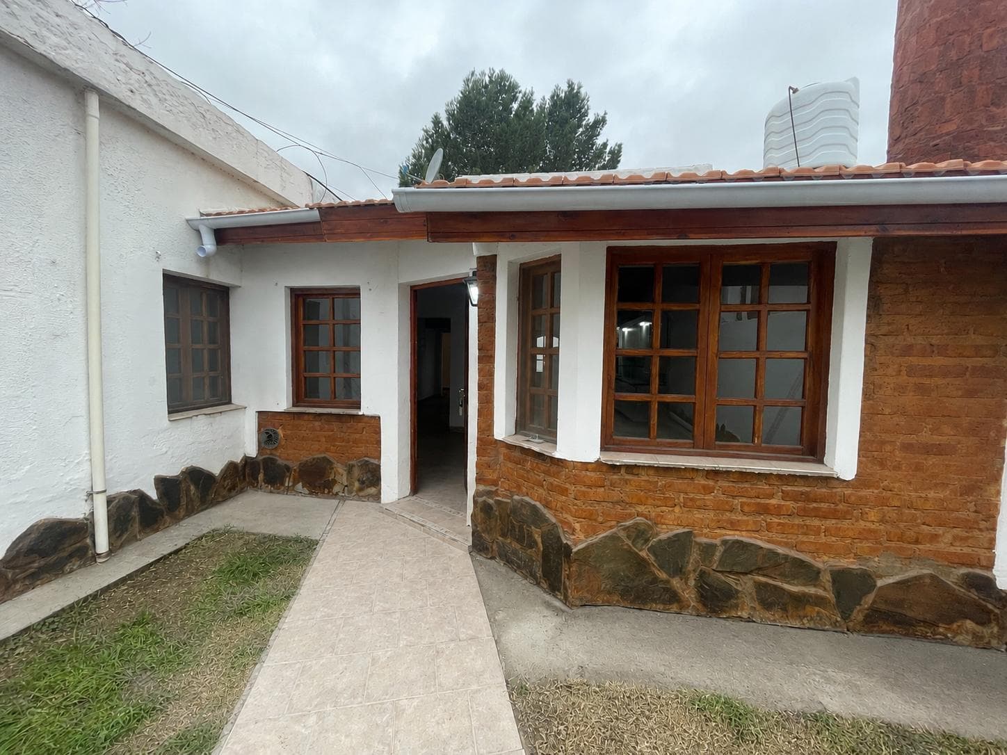 3-bedroom house with a barbecue and a garage