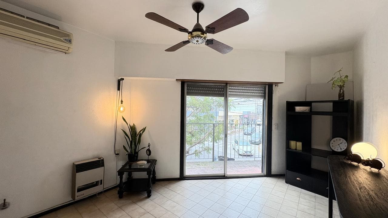 Two-bedroom townhouse for sale, with a terrace and garage; commercial space currently generating rental income