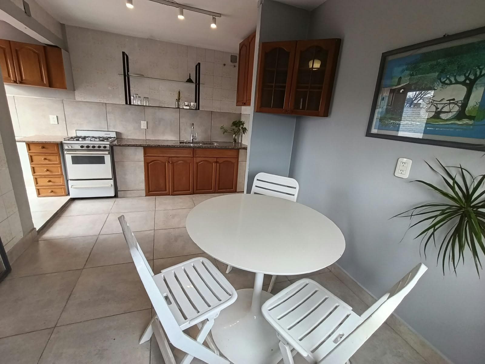 Two-bedroom townhouse for sale, with a terrace and garage; commercial space currently generating rental income