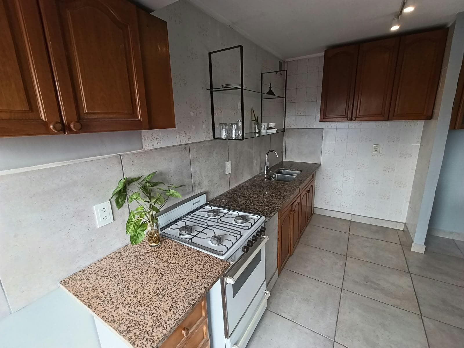 Two-bedroom townhouse for sale, with a terrace and garage; commercial space currently generating rental income