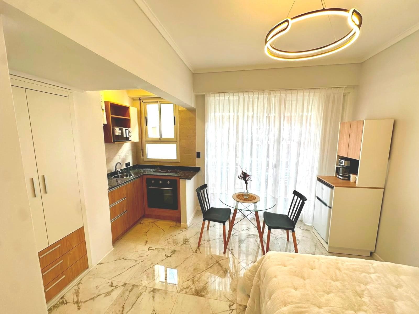 1-Bedroom Apartment with a Balcony and a Side View of the Ocean