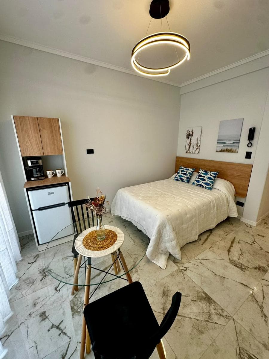 1-Bedroom Apartment with a Balcony and a Side View of the Ocean