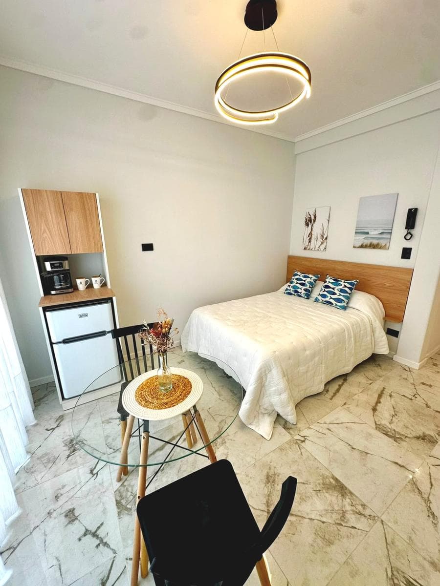 1-Bedroom Apartment with a Balcony and a Side View of the Ocean