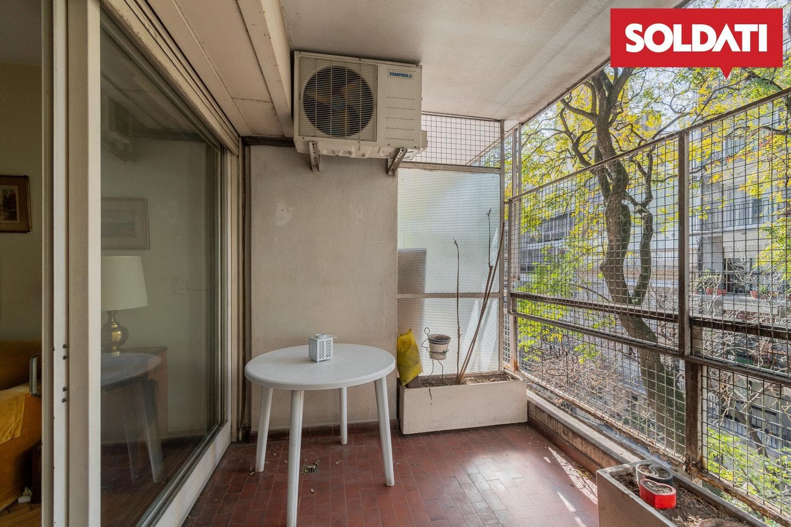For sale: 4-room apartment with a balcony and a terrace, plus a built-in garage on the ground floor; total area: 84 m