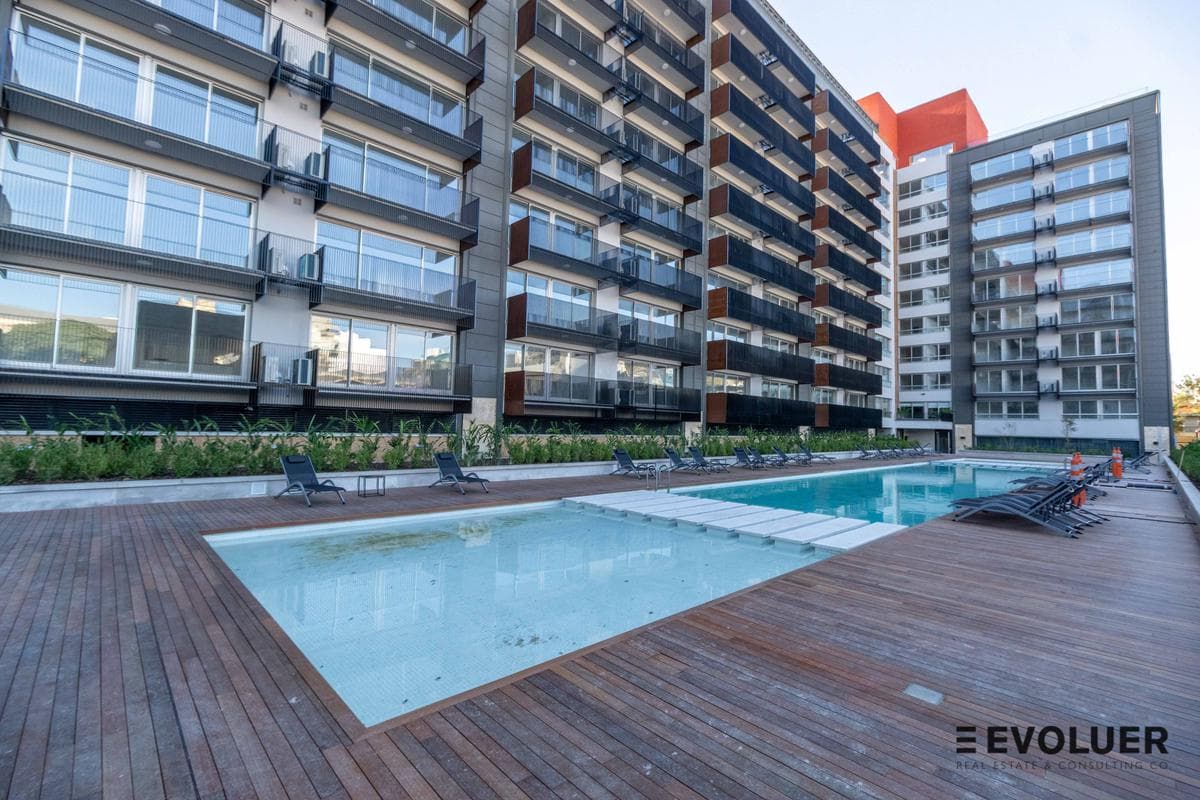 Apartment for rent with a garage, fully equipped, furnished, and with amenities.
