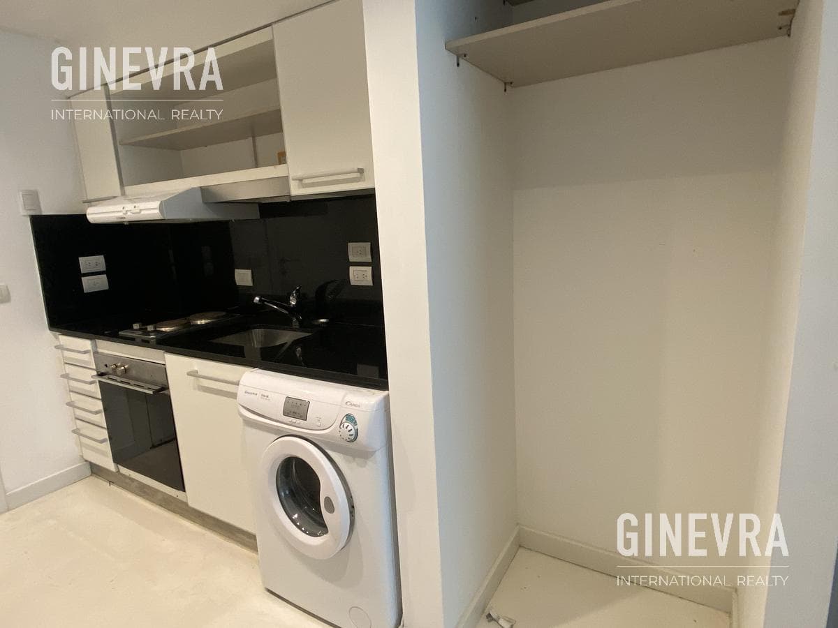 Open-concept studio apartment in Puerto Madero with a balcony and a parking space.