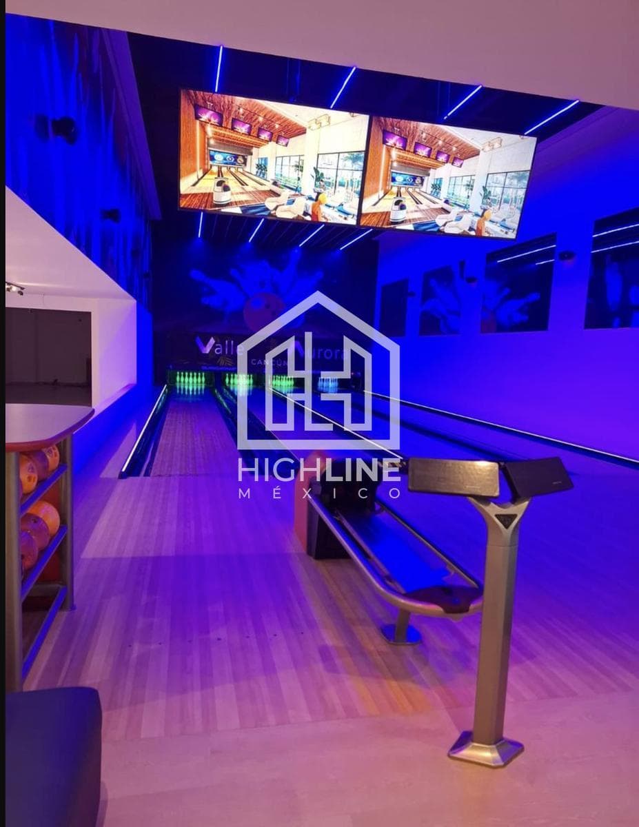 2-Bedroom Condo for Sale in Cancún with a Bowling Alley and Family Areas