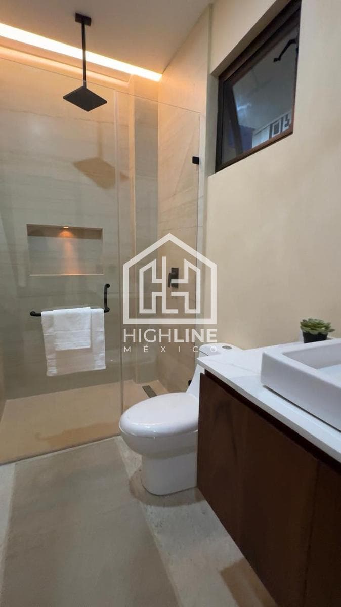 1-BEDROOM APARTMENT FOR SALE IN PLAYA DEL CARMEN WITH AN INFINITY POOL, GYM, AND RESTAURANT