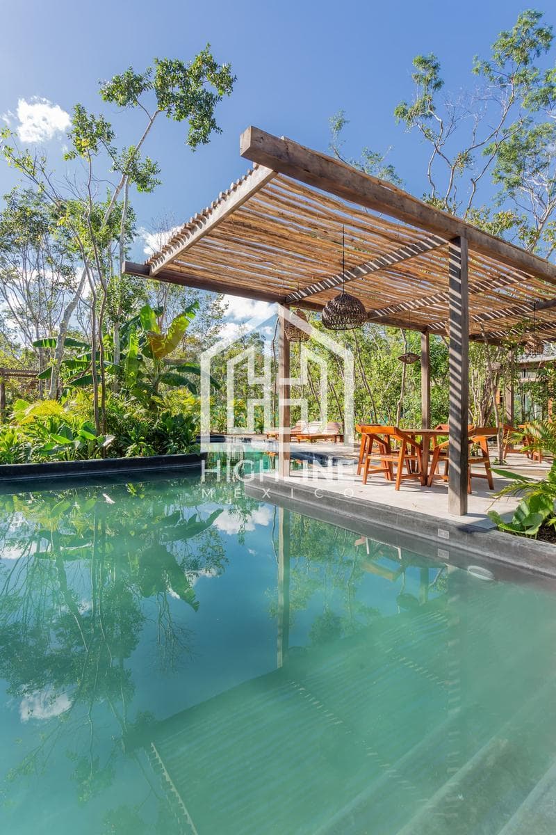 HOUSE FOR SALE IN TULUM: 3 BEDROOMS WITH INFINITY POOL, GATHERING AREA, AND PLAY AREA FOR CHILDREN
